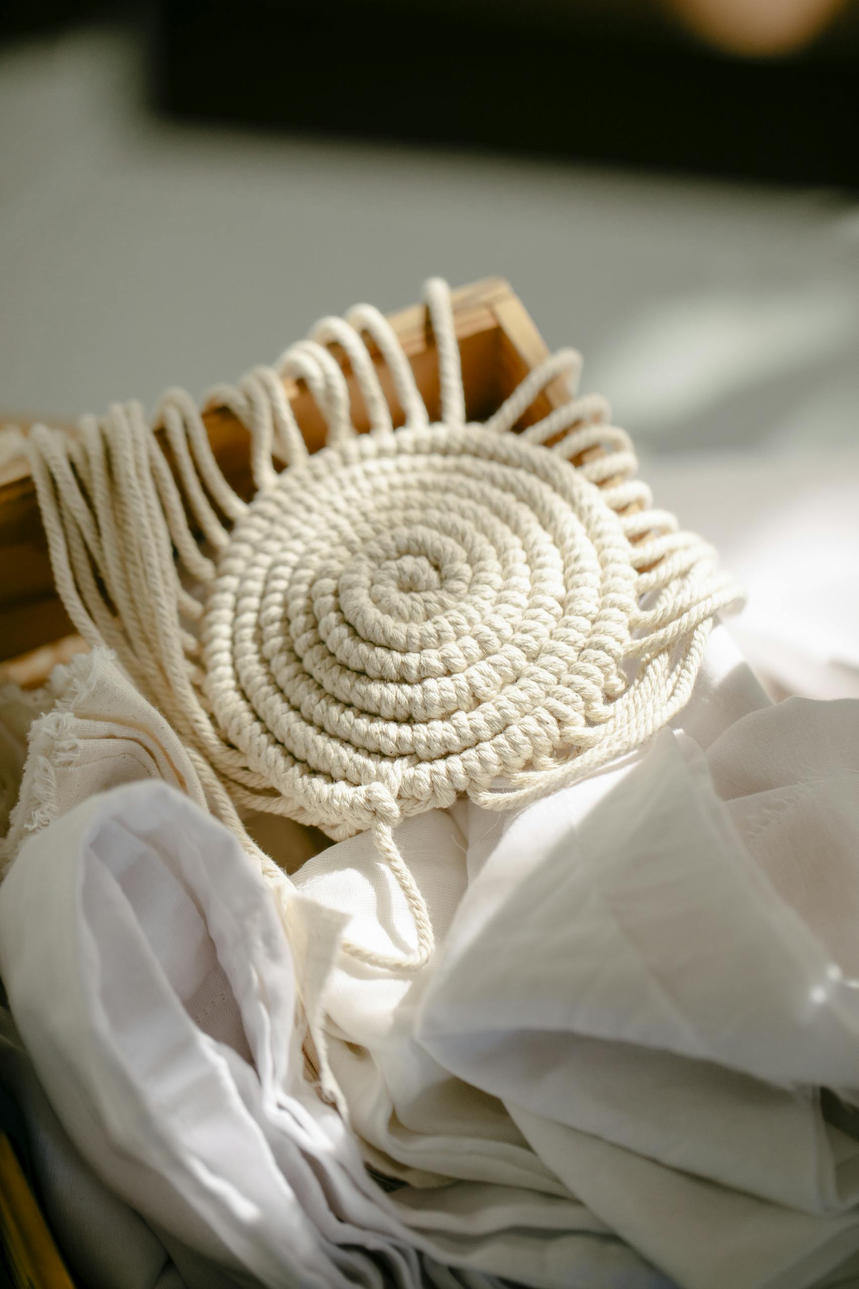 Beige needlework on wooden frame in light room