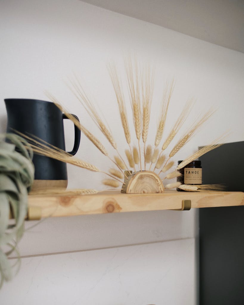 Black Ceramic Mug on Brown Wooden Shelf
